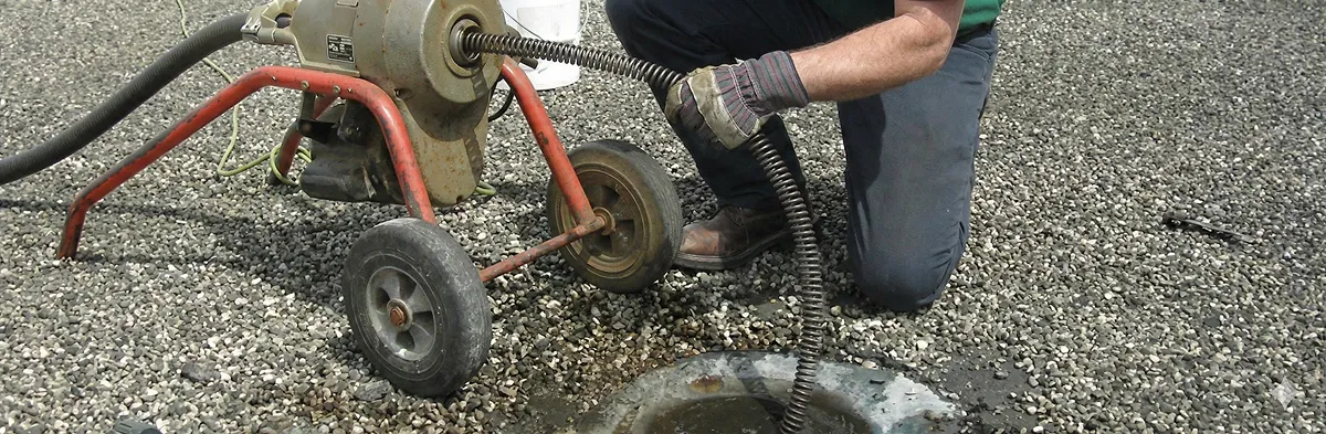 sewer rodding technician actively removing blockages from a sewer line in Philadelphia, PA